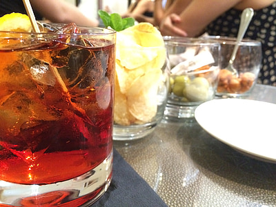 four clear drinking glasses on top of table thumbnail