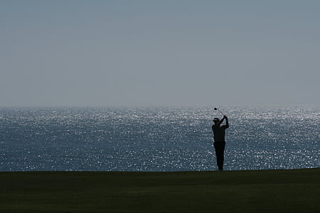 man holding golf club thumbnail