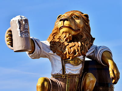lion holding beer mug statue at daytime thumbnail