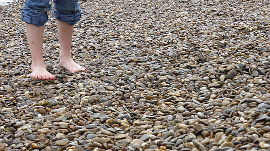 person standing on rock shore thumbnail