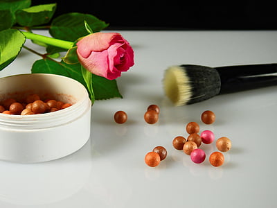pink rose flower near bronzer thumbnail