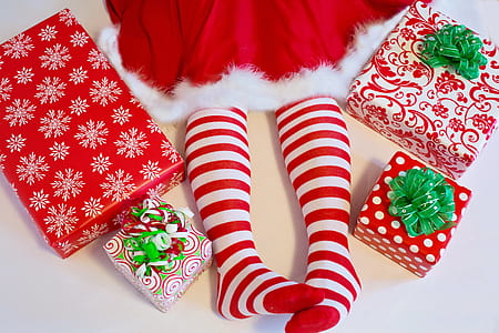 person wearing red-and-white skirt and striped socks thumbnail