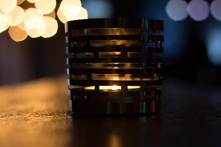 macro shot photography of gray steel candle holder thumbnail