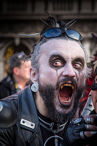 man wearing black leather jacket and makeup during daytime thumbnail