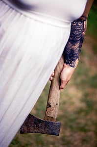 person holding axe thumbnail