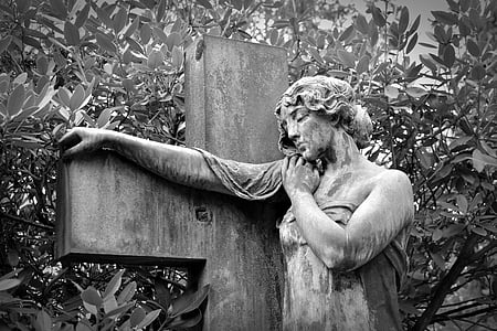 human leaning on cross statue thumbnail