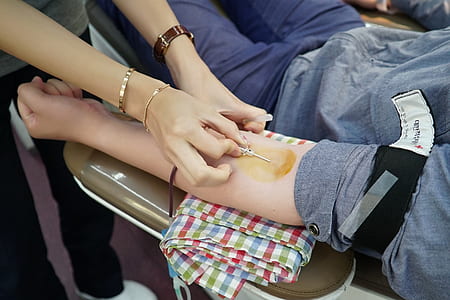 person injects syringe on human arm thumbnail