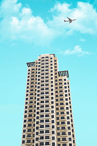 passenger plane soaring above building illustration thumbnail