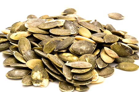 photography of brown sunflower seed on white surface thumbnail