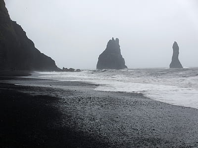 rock formation on body of water thumbnail