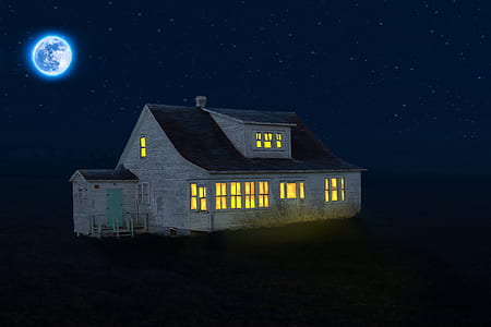 gray and black wooden house during nighttime thumbnail