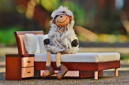 plush toy sitting on bed toy thumbnail