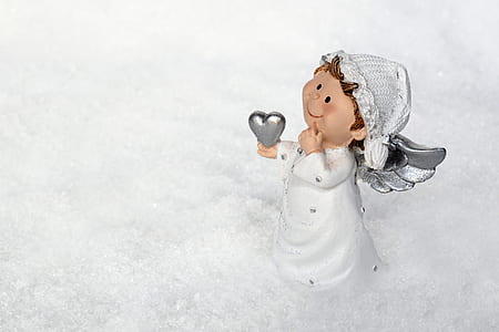 cherub holding heart figurine thumbnail