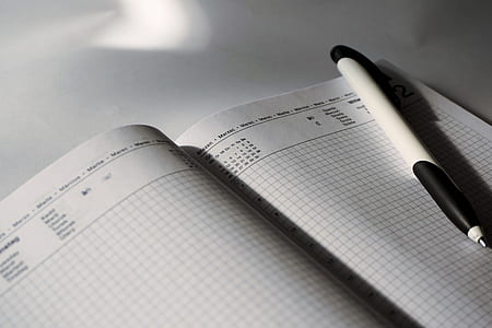 white book and click pen thumbnail