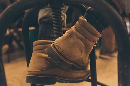 close-up photo of person wearing brown work boots thumbnail