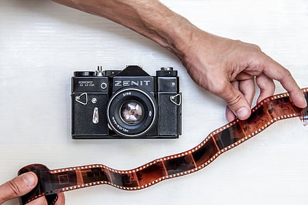 person holding camera film thumbnail