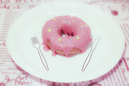 pink coated doughnut on white plate thumbnail
