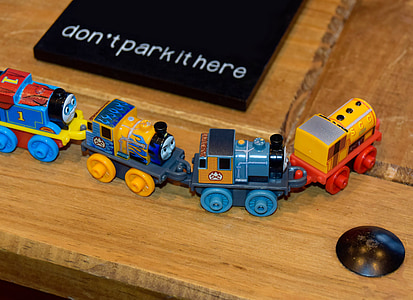 multicolored train toy on brown surface thumbnail