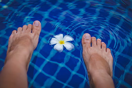 Person's Feet on Swimming Pool thumbnail
