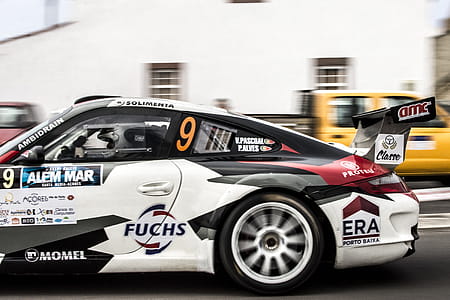 Photography of Person Driving Porsche thumbnail