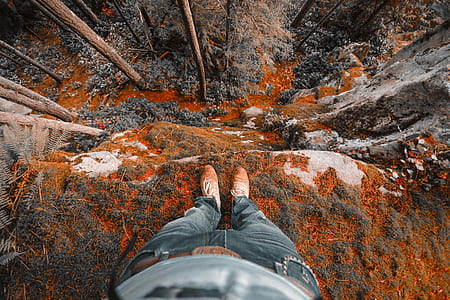 person standing near mountain cliff thumbnail