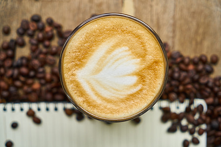 coffee with cup surrounded by coffee beans thumbnail