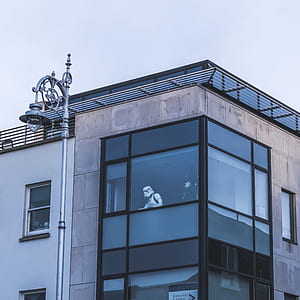 Stormtrooper inside building looking through window during daytme thumbnail