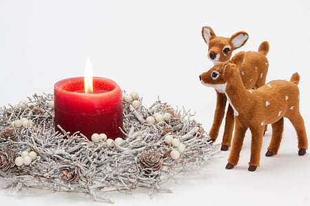 red pillar candle and two brown deer figurine thumbnail