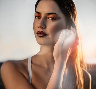 closeup photo of woman holding her hair thumbnail