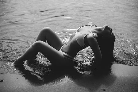 grayscale shot of woman wearing white bikini thumbnail