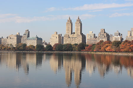 white high-rise building beside body of water thumbnail