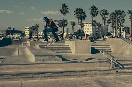man doing a kick flip in mid air thumbnail