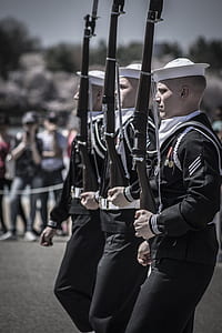 military marched while holding rifles thumbnail