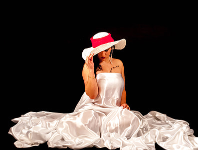 woman holding hat sitting thumbnail