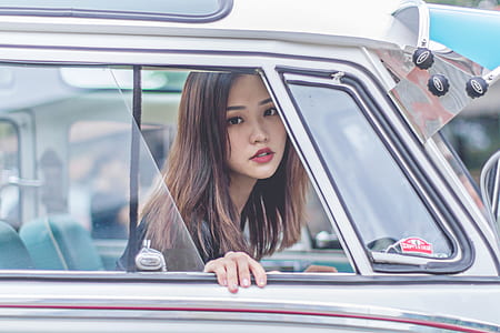 woman sitting inside car thumbnail