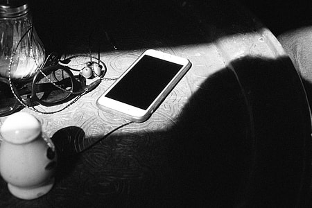 iPhone on table black and white thumbnail