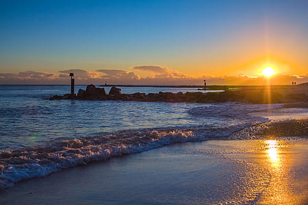 photo of a sunrise on seashore thumbnail