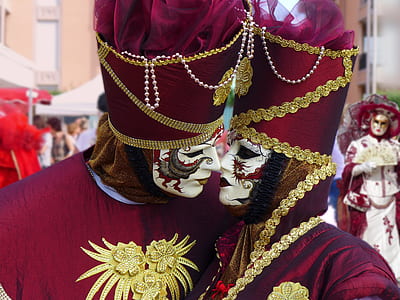 two persons wearing masquerade about to kiss each other thumbnail