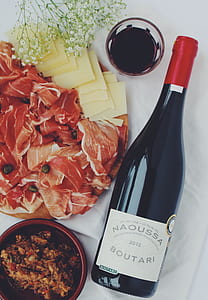 photo of Naoussa Boutari bottle beside bowl and raw meat thumbnail
