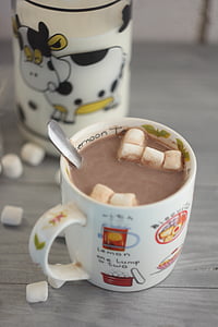 chocolate drink with marshmallows in white ceramic mug thumbnail