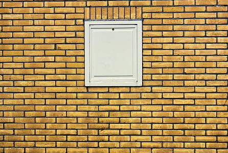 closed white door on brown wall thumbnail