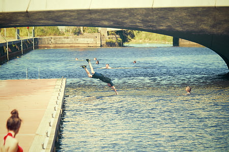 person diving in body of water thumbnail