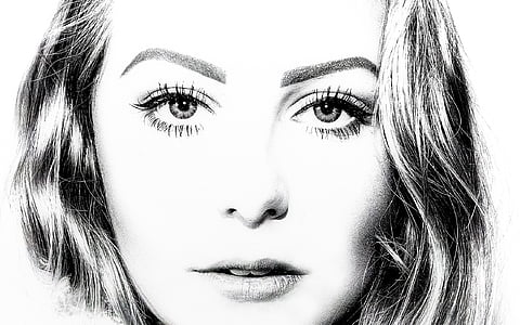 grayscale photo of woman thumbnail