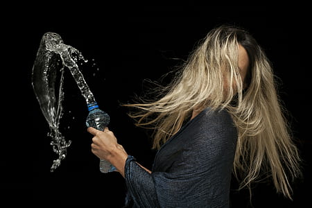 woman holding plastic bottle with water thumbnail