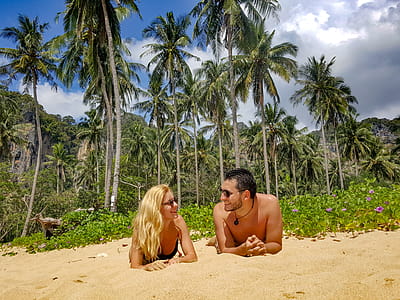 Man and Woman Lying on Sand thumbnail