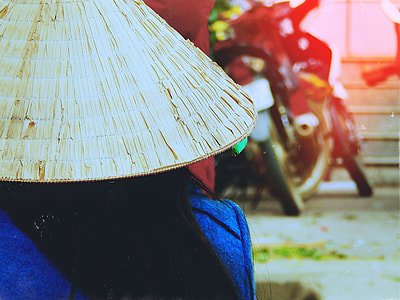 person wearing round native hat thumbnail