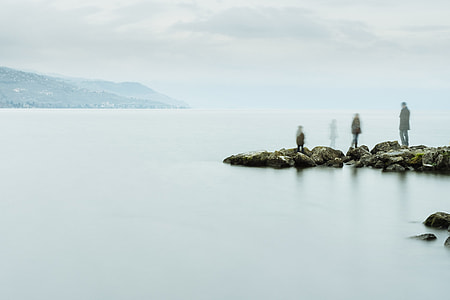 people standing near water thumbnail