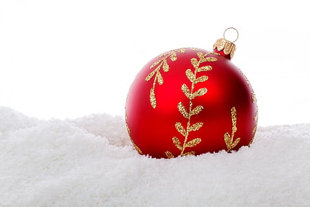 red and gold glitter bauble on white cloth thumbnail