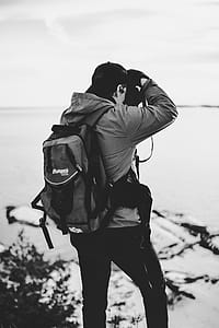 Grayscale Photography of Man Taking Photo thumbnail
