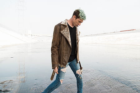 man looking down on body of water thumbnail
